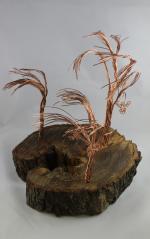 Product Description: Artistic Trees crafted from slabs from the Derecho created by a local artist Young Jimages.</br></br>Pick Up only- Resource Center- 1150 27th Ave SW Cedar Rapids, Iowa 52404</br> Artistic Tree-8