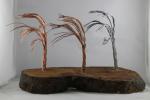 Product Description: Artistic Trees crafted from slabs from the Derecho created by a local artist Young Jimages.</br></br>Pick Up only- Resource Center- 1150 27th Ave SW Cedar Rapids, Iowa 52404</br> Artistic Tree-4