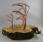 Product Description: Artistic Trees crafted from slabs from the Derecho created by a local artist Young Jimages.</br></br>Pick Up only- Resource Center- 1150 27th Ave SW Cedar Rapids, Iowa 52404</br> Artistic Tree-6