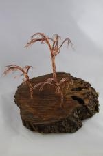 Product Description: Artistic Trees crafted from slabs from the Derecho created by a local artist Young Jimages.</br></br>Pick Up only- Resource Center- 1150 27th Ave SW Cedar Rapids, Iowa 52404</br> Artistic Tree-7